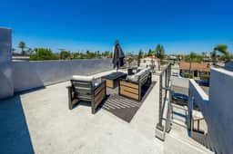 Modern Urban Escape w/ Rooftop & Walkable Fun - Image 4